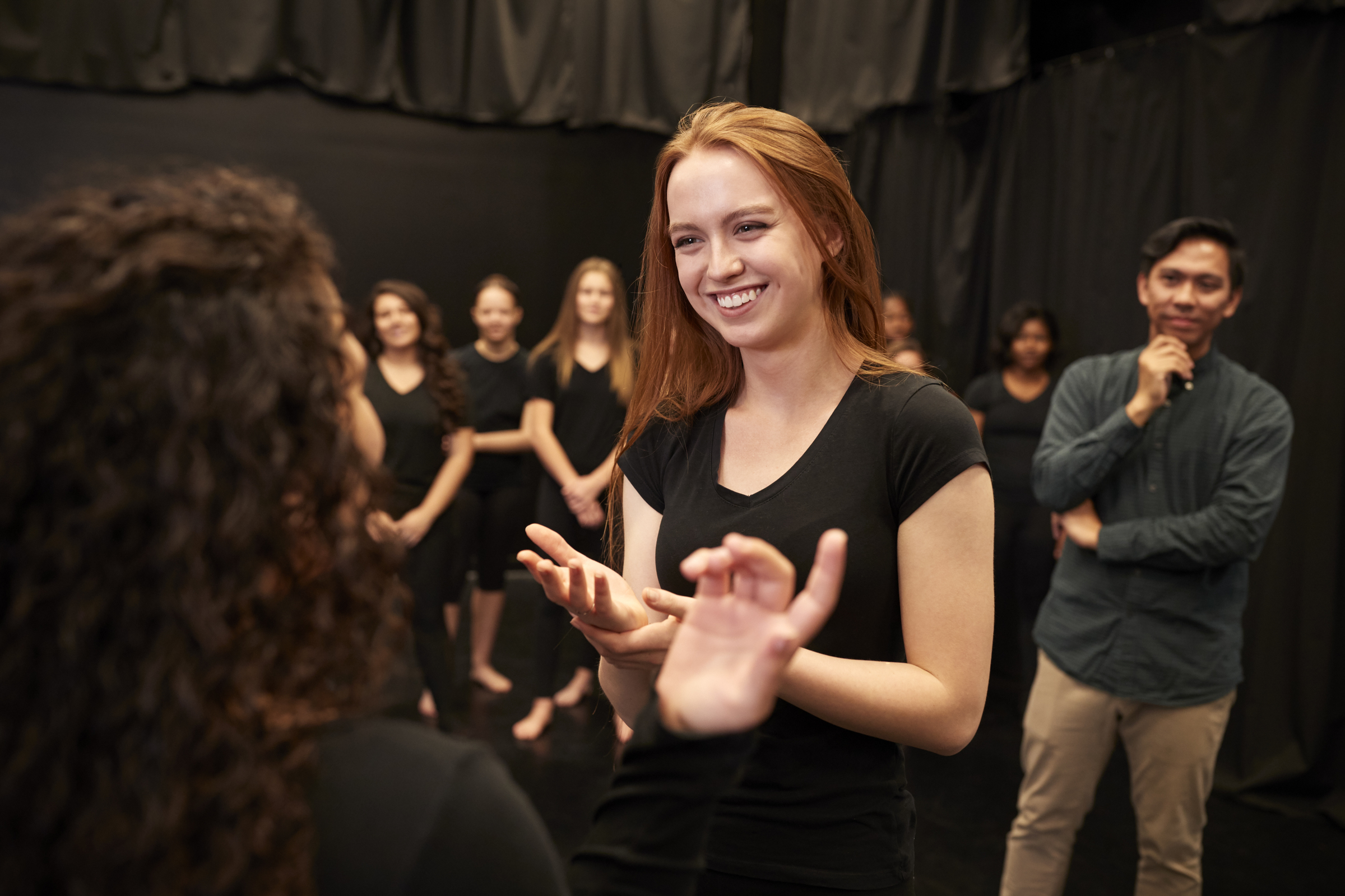 teacher-with-male-and-female-drama-students-at-7KL9QJ6.jpg